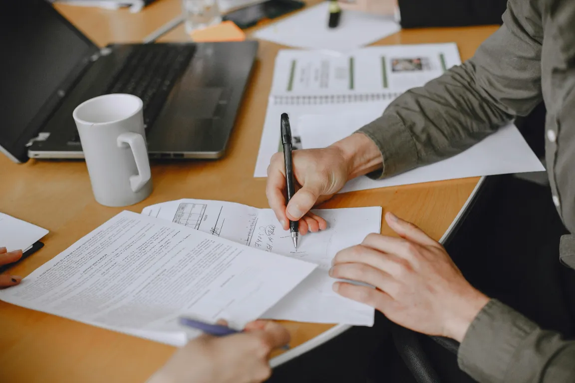 close up image of someone signing papers
